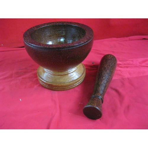 185 - Turned dark hardwood mortar and pestle (height of mortar 14cm, diameter 18cm. Length of pestle 23cm)