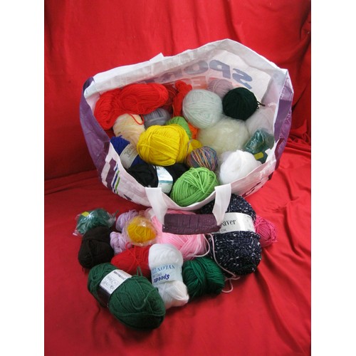 269 - A large assortment of unused balls of wool in various colours, a tray of knitting needles, a box of ... 