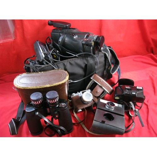 276 - An assortment of various cameras both film and video, plus a pair of cased binoculars