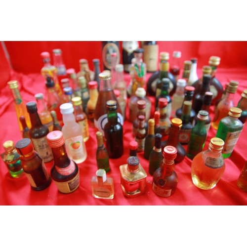 84 - A large quantity of vintage alcoholic miniatures, sealed