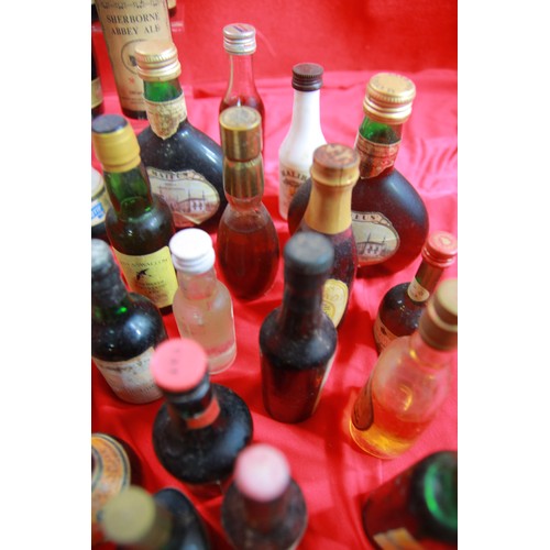 84 - A large quantity of vintage alcoholic miniatures, sealed