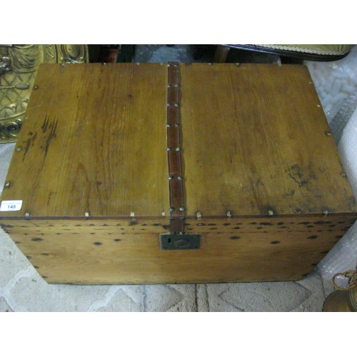 148 - A pine trunk with decorative leather strip and non-functioning lock fitting, height 37cm width 68cm ... 