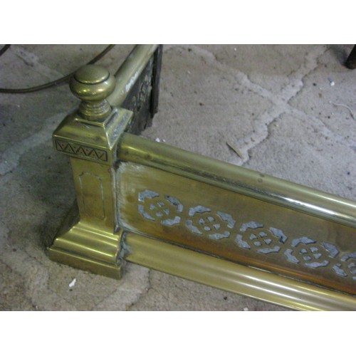 94 - Brass fire curb with pierced panels, width 132cm depth 25cm, A/F, one end panel is missing top and b... 