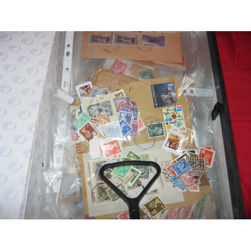 241 - A large stack comprising stockbooks containing mainly UK stamps, stamp collecting albums and supplie... 