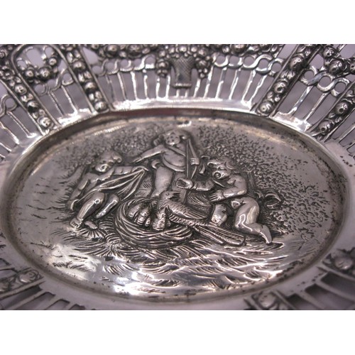 215 - A pierced silver bon-bon dish of Swedish manufacture decorated with a relief of cupid and cherubs, S... 