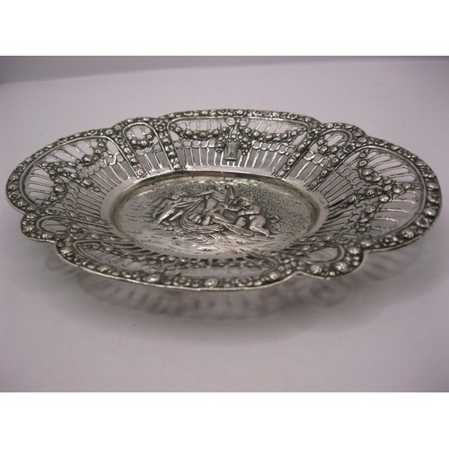 215 - A pierced silver bon-bon dish of Swedish manufacture decorated with a relief of cupid and cherubs, S... 