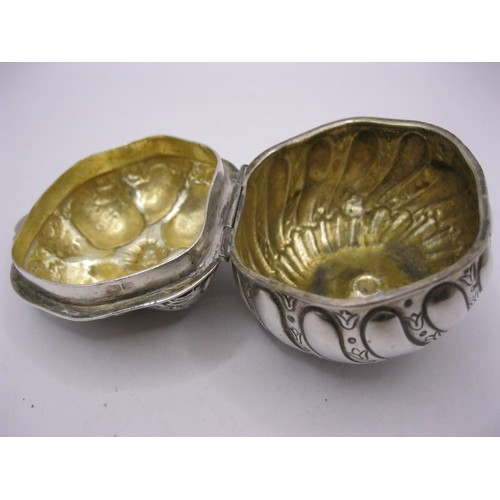 226 - An 800 silver trinket box of unusual form with fluted base, hinged lid and gilded interior, foreign ... 