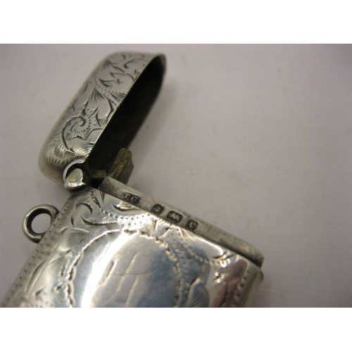 263 - A small sterling silver vesta case with fob loop and integral striker, hallmarked for Birmingham 190... 