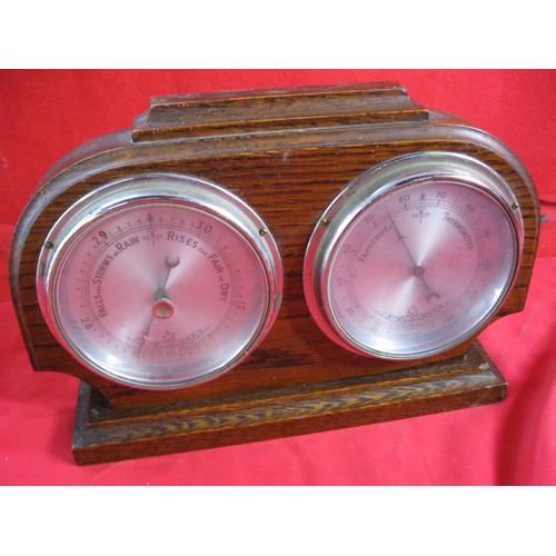 324 - A vintage mounted barometer and thermometer