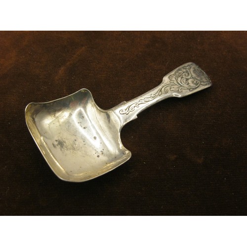 39 - A Victorian Silver Caddy Spoon with Ornate Chased Handle.  Hallmarked Birmingham `946 by George Unit... 
