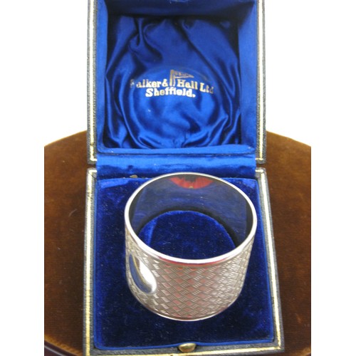 28 - A Silver Heavy Gauge Napkin Ring in presentation box.  Sheffield Hallmarked 1927, 61.5gm