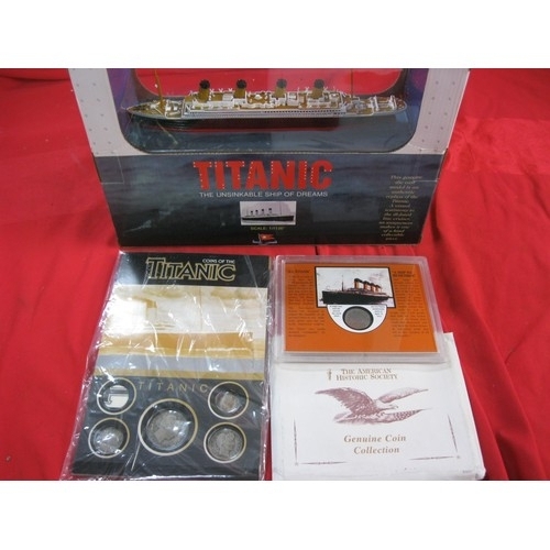 108 - A die cast model of RMS Titanic, boxed and mint, an American Historical Society encapsulated 1912 ni... 