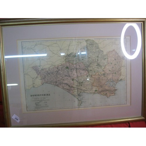 171 - A Bacon's Geographical framed and glazed map of Dorsetshire, fold to centre but in good order, c1910