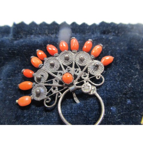 4 - A filigree and Coral pin brooch along with a coral tie pin and a seed pearl bar brooch