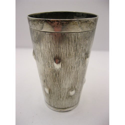 223 - A silver stirrup cup, the exterior fashioned like a hawthorne or walnut section with burrs, hallmark... 