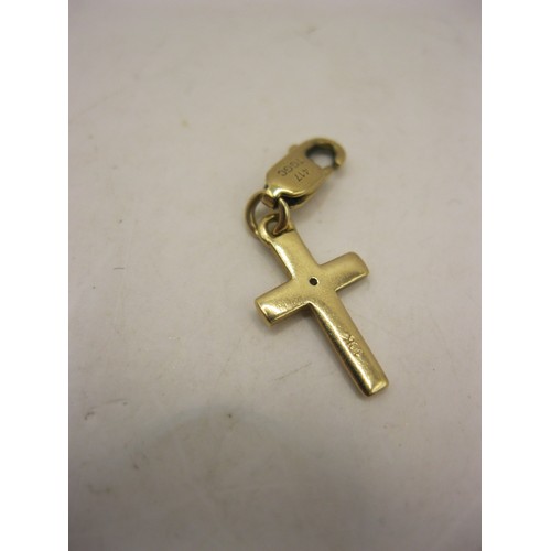 235 - A small 10 carat gold crucifix with a small diamond mounted to centre, marked for Milano, Italy. App... 