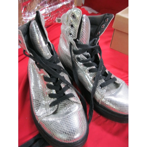 279 - A pair of ladies Dr Marten's boots, crepe soles and spangly silver finish, very little if any wear, ... 