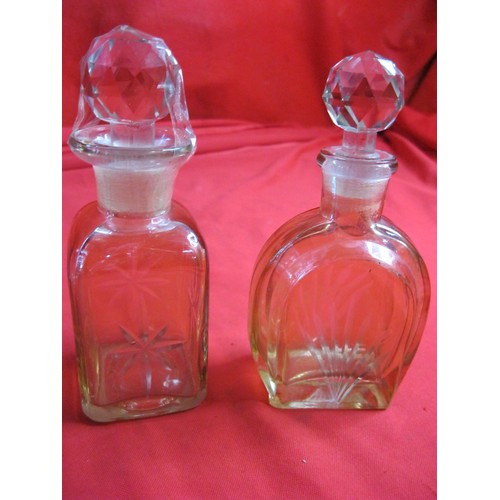 17 - A pair of pink glass dressing table bottles with spherical stoppers (height 20cm, good condition but... 