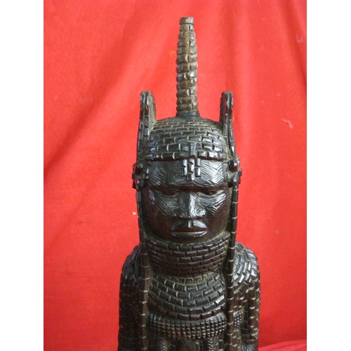 71 - Nigerian Benin style carved wood figure of warrior chief in mail and head-dress holding sword, heigh... 