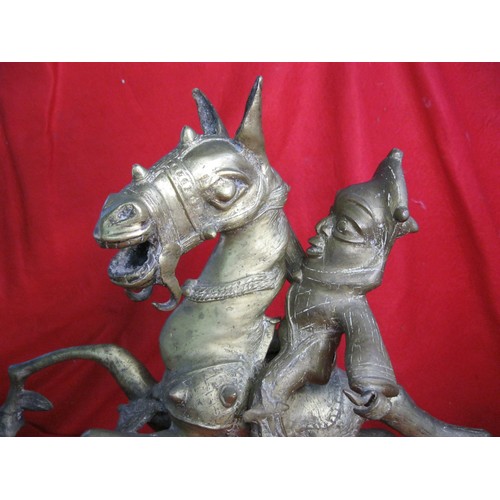 75 - Nigerian brass figure of horse and rider. The horse modelled as rearing on hind legs in gambado stan... 