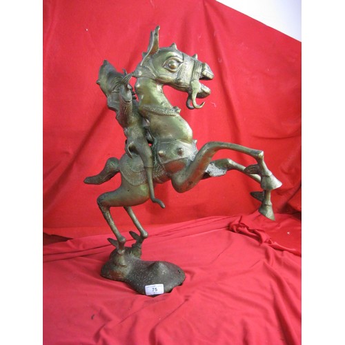 75 - Nigerian brass figure of horse and rider. The horse modelled as rearing on hind legs in gambado stan... 