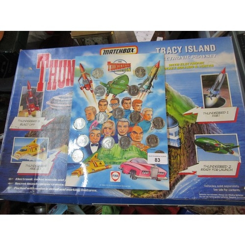 83 - A fully boxed Tracey island playset along with a set of Fina Thunderbirds car collector coins.
Trace... 