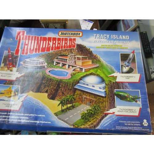 83 - A fully boxed Tracey island playset along with a set of Fina Thunderbirds car collector coins.
Trace... 