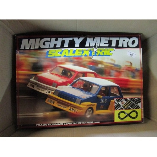 89 - A Scalextric Mighty Metro set with cars ,controllers and some track all as per pictures