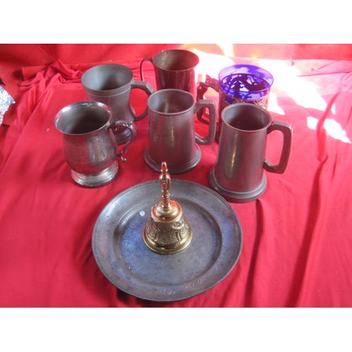 163 - A box of pewter items, mainly flagons, plus an blue glass drinking cup in a white metal and enamel h... 