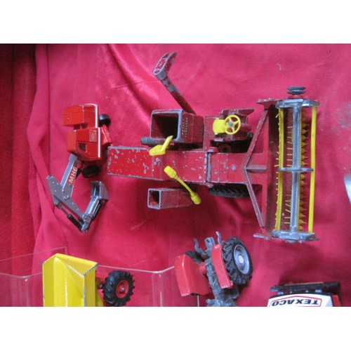 141 - About 16 die cast agricultural and works model vehicles including combine harvester, fork lift truck... 