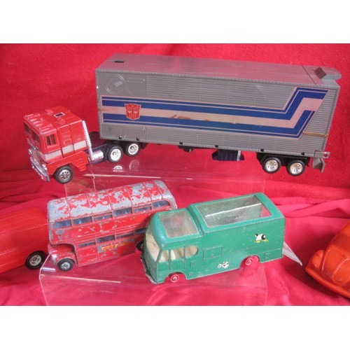 145 - About 24 various die cast and plastic cars and vehicles including Hasbro Optimus Prime (A/F), all in... 