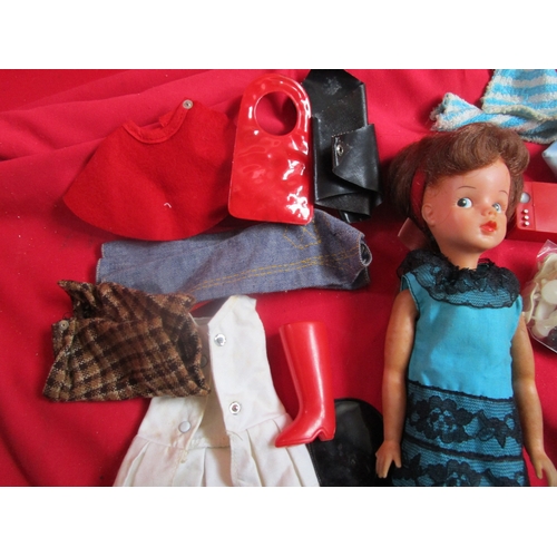 148 - Sindy Doll with a whole host of clothing and accessories to include Boots, Hand bag, Skis(one broken... 