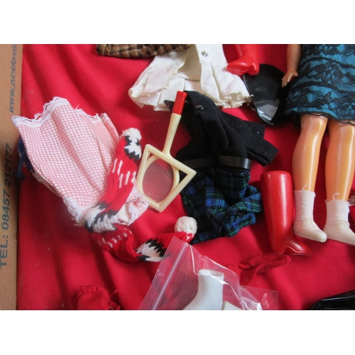 148 - Sindy Doll with a whole host of clothing and accessories to include Boots, Hand bag, Skis(one broken... 