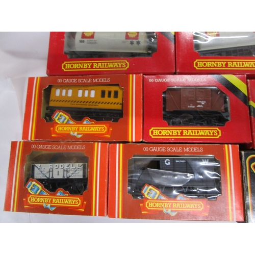 160 - Nine Hornby Commercial wagons including Shell tankers and a track cleaning wagon  and two Mainline r... 