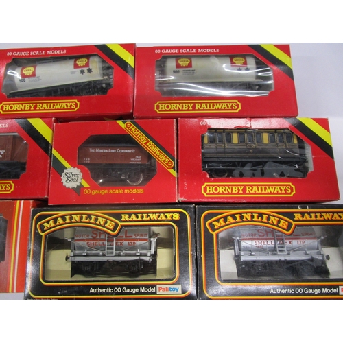 160 - Nine Hornby Commercial wagons including Shell tankers and a track cleaning wagon  and two Mainline r... 