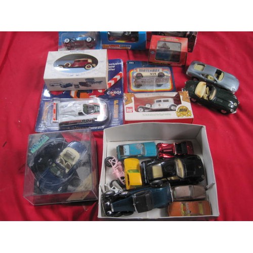 162 - A mixed assortment of boxed and unboxed model vehicles including Vitesse V100D Jaguar XK8, Matchbox ... 