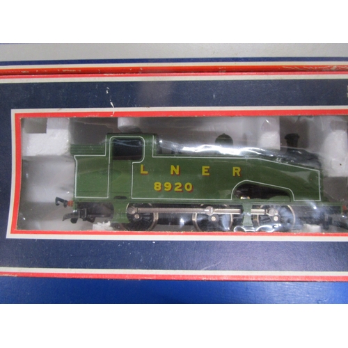 169 - A boxed Lima J50 steam locomotive in OO along with four commercial double bogie wagons to include a ... 