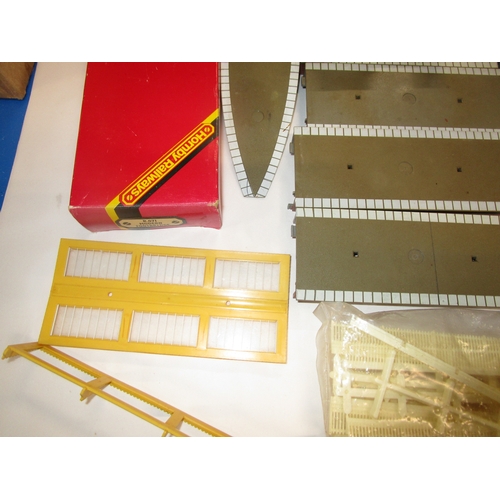 190 - Nine sections of hornby platform plus three end ramps .A new boxed Platform canopy pack and a pack o... 