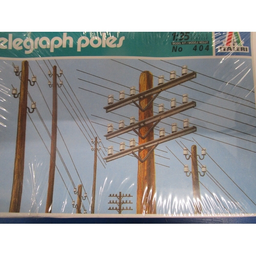 194 - Three Italeri sealed model kits all in 1.35 scale 1 Brick walls 2 Barricades and 3 Telegraph Poles