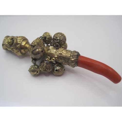 11 - A very ornate silver Gilt and Coral babies rattle ,Teether and whistle of exceptional quality in pri... 