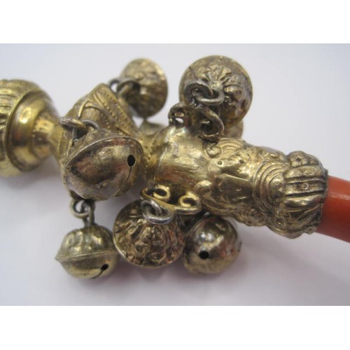 11 - A very ornate silver Gilt and Coral babies rattle ,Teether and whistle of exceptional quality in pri... 