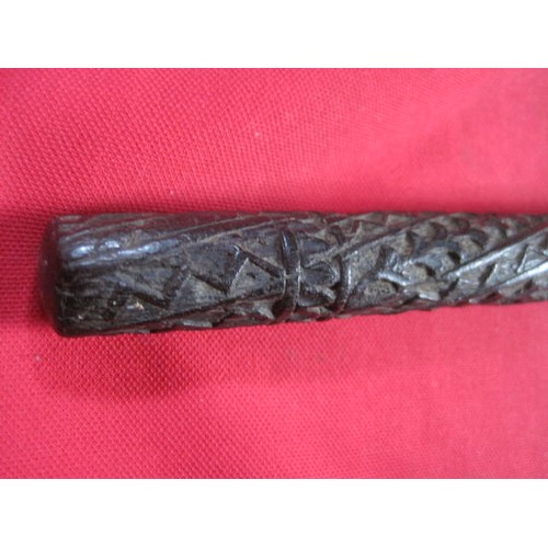 38 - A late Victorian silver collared carved ebony walking cane, believed of Indian origin