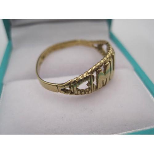 41 - A 9 carat gold ring, slightly mishapen to one side, the front bearing the word 'Mum' flanked by hear... 