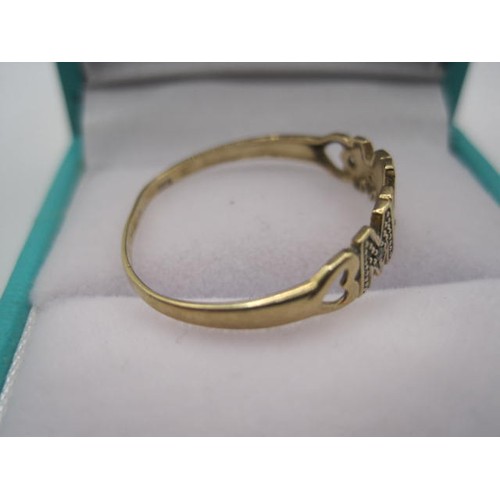 42 - A 9 carat gold ring shaped to spell the word 'Mum', the letters highlighted in white gold and each f... 