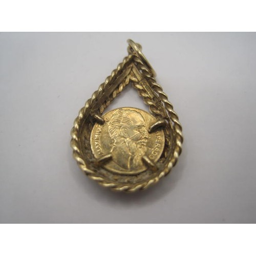 46 - A Mexican 1 peso gold coin with wear and damage, in 22 carat gold, mounted in a 9 carat gold pendant... 