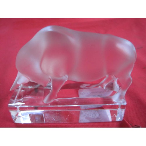 78 - Lalique crystal bull paperweight, the bull is frosted and standing on a clear rectangular base with ... 