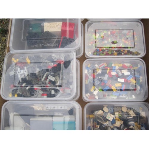 200 - Assorted Lego bricks and components contained in ten tubs in a black cardboard fruit crate