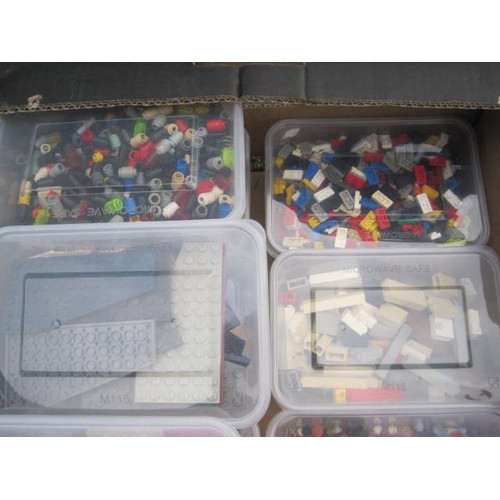 200 - Assorted Lego bricks and components contained in ten tubs in a black cardboard fruit crate