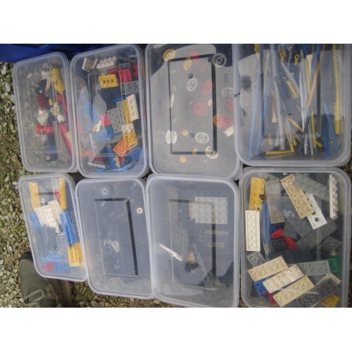 206 - Various Lego bricks and components, wheels and spindles. Contained in 28 tubs in a large blue plasti... 