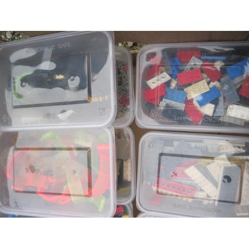 207 - Various Lego bricks and components, wheels, disks, etc, contained in 16 tubs in a cardboard banana b... 